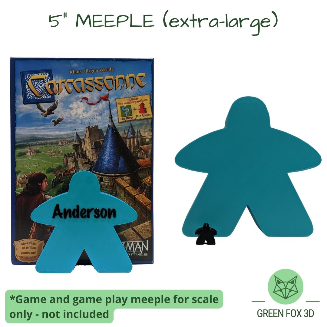 A comparison of a personalized, 5 inch meeple against game token and board game box.